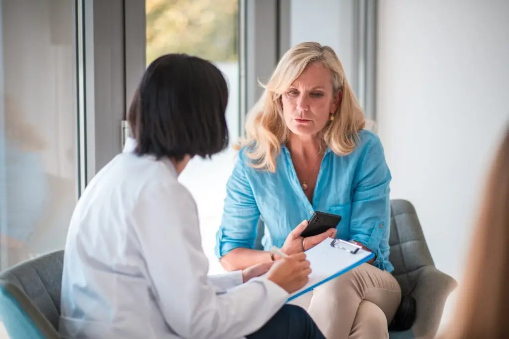 woman talking to doctor in a clinic