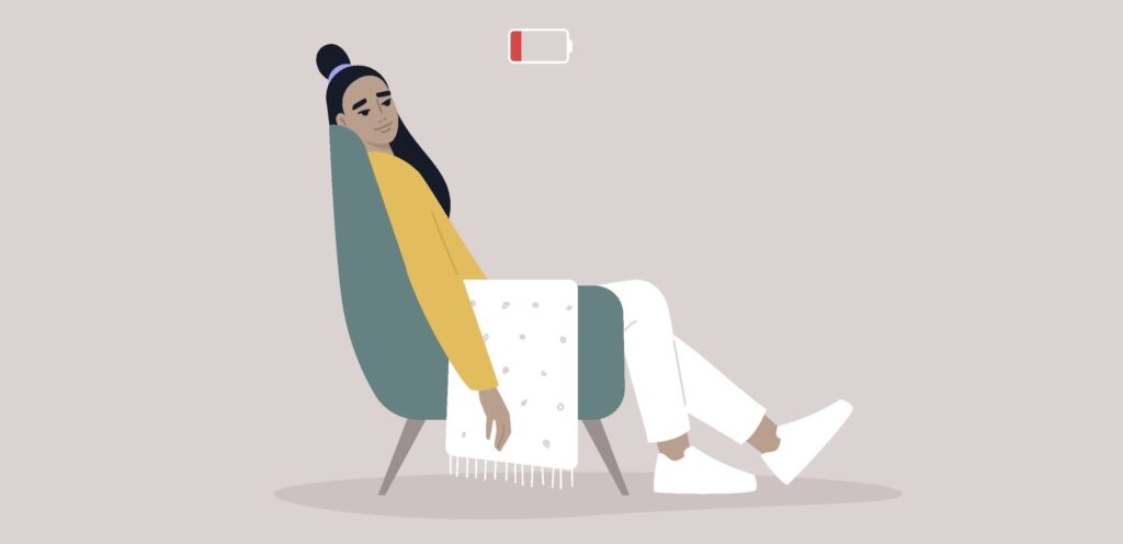 Illustration of woman sitting back in chair with blanket over her legs, uncharged battery icon over her head