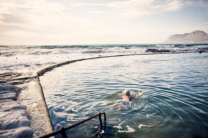 shot of a senior woman swimming outdoors in the ocean