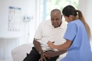 An Elderly Gentleman in His Doctors Office Receiving a Check-Up