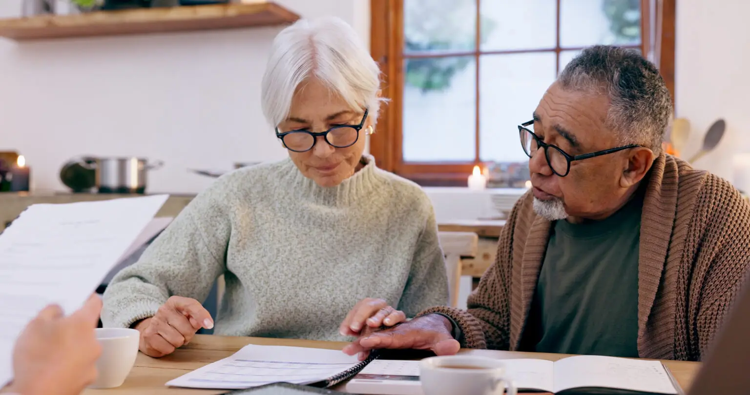 Couple, paperwork and reading. discussion for future