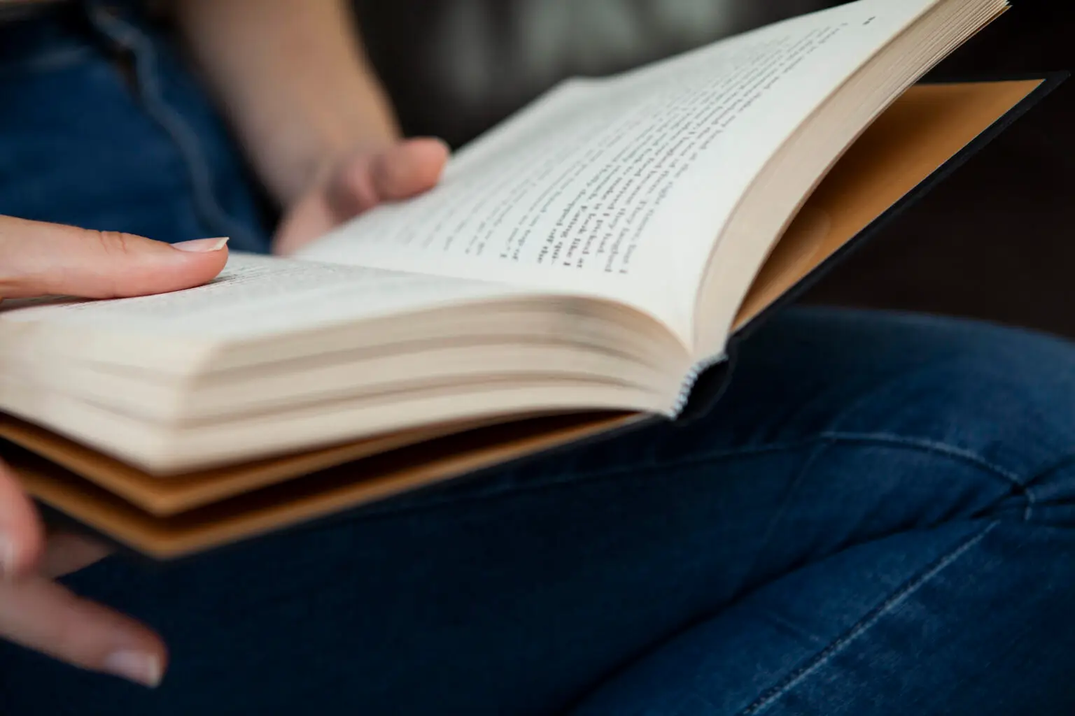 Close-up of hands holding a book