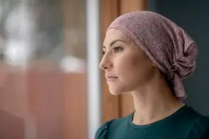 breast cancer patient looking outside the window