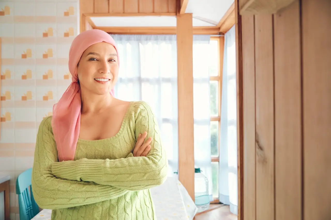 breast cancer patient smiling at home