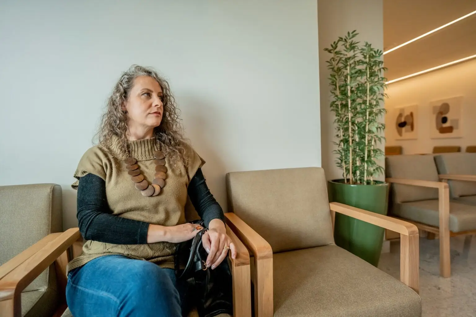 woman waiting in the doctors office sitting