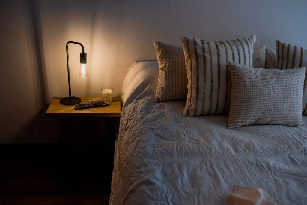 picture of electric lamp next to bed