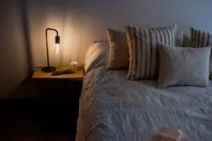 picture of electric lamp next to bed