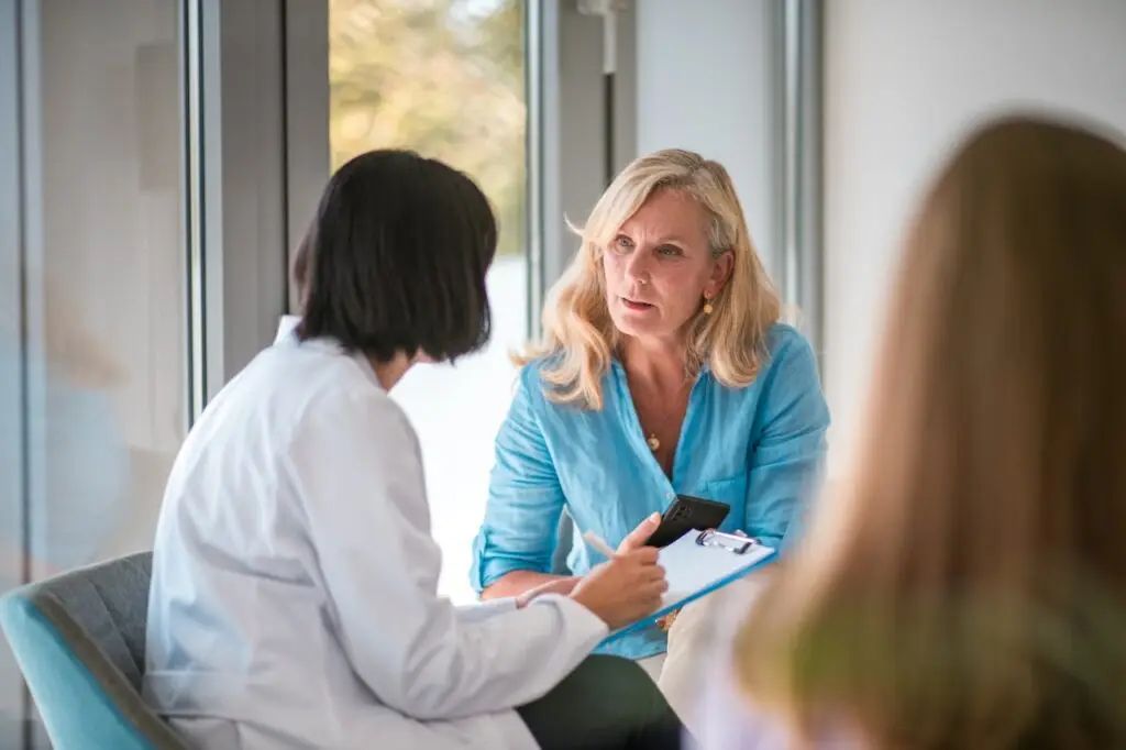 woman consulting with a doctor in the waiting room