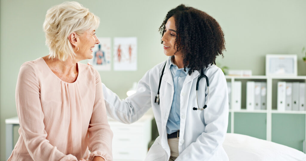 doctor consulting older woman