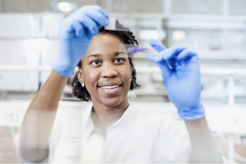 scientist research holding up a test tube