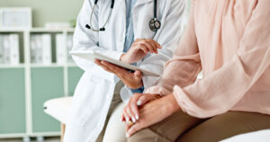 Clinic, tablet and hands of doctor with patient for consulting