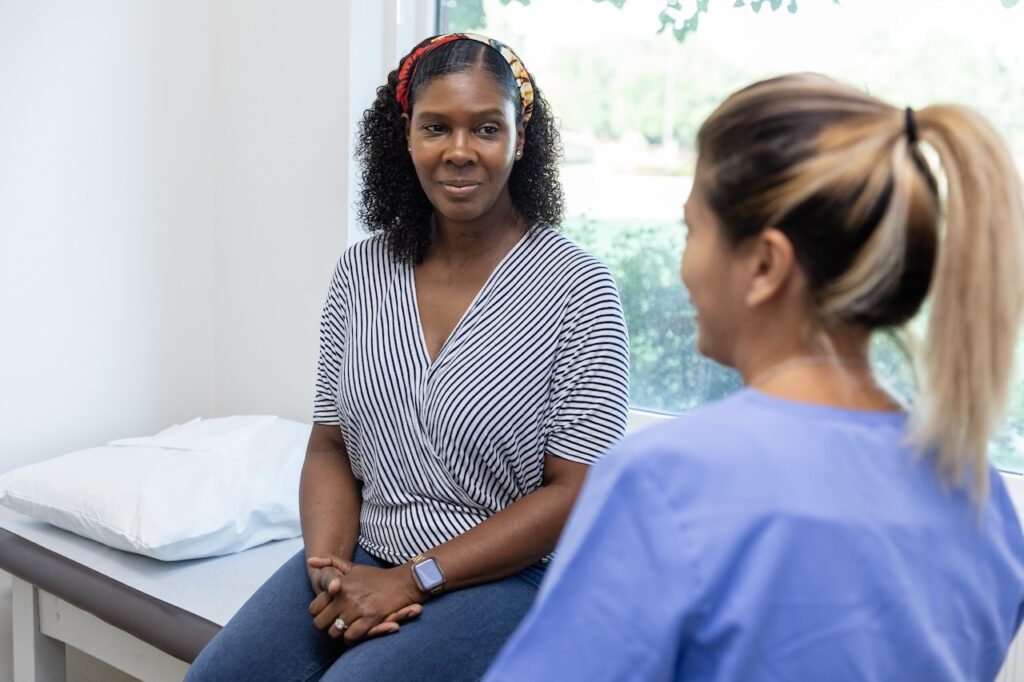 patient speaking with healthcare professional in a clinic