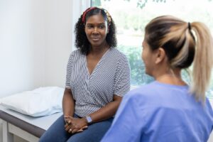 patient speaking with healthcare professional in a clinic