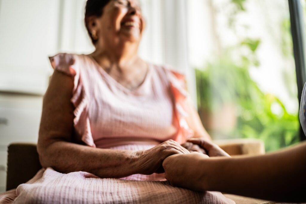 caregiver talking with a senior woman