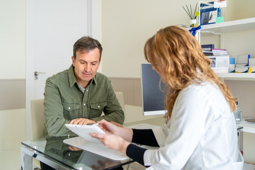 Man talking to doctor about test results