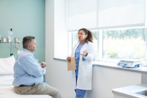 doctor talking to a patient discussing care plans