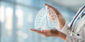 Doctor reviews the 9th edition TNM staging for lung cancer using a digital lungs graphic.