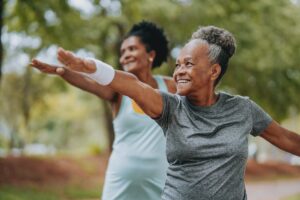 Two women friends doing exercises together