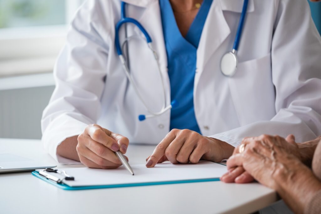 doctor discussing test results with senior woman
