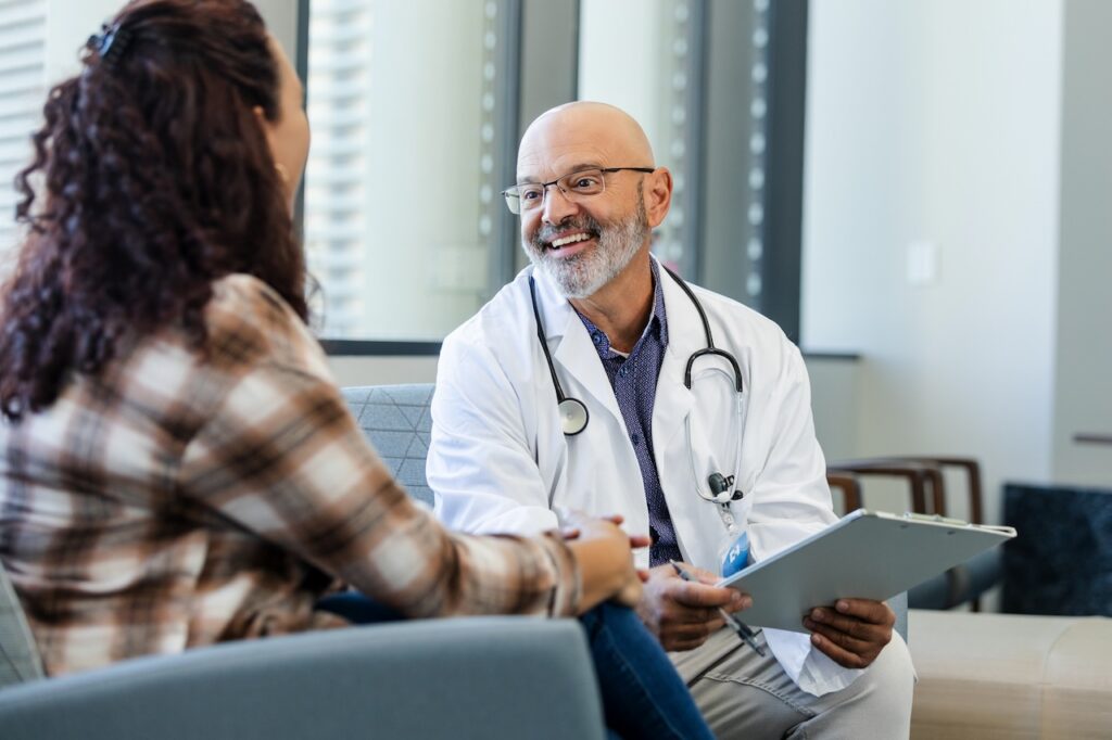 doctor in consultation with a patient.