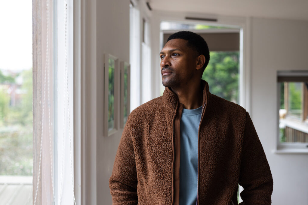 Male Looking Through Window
