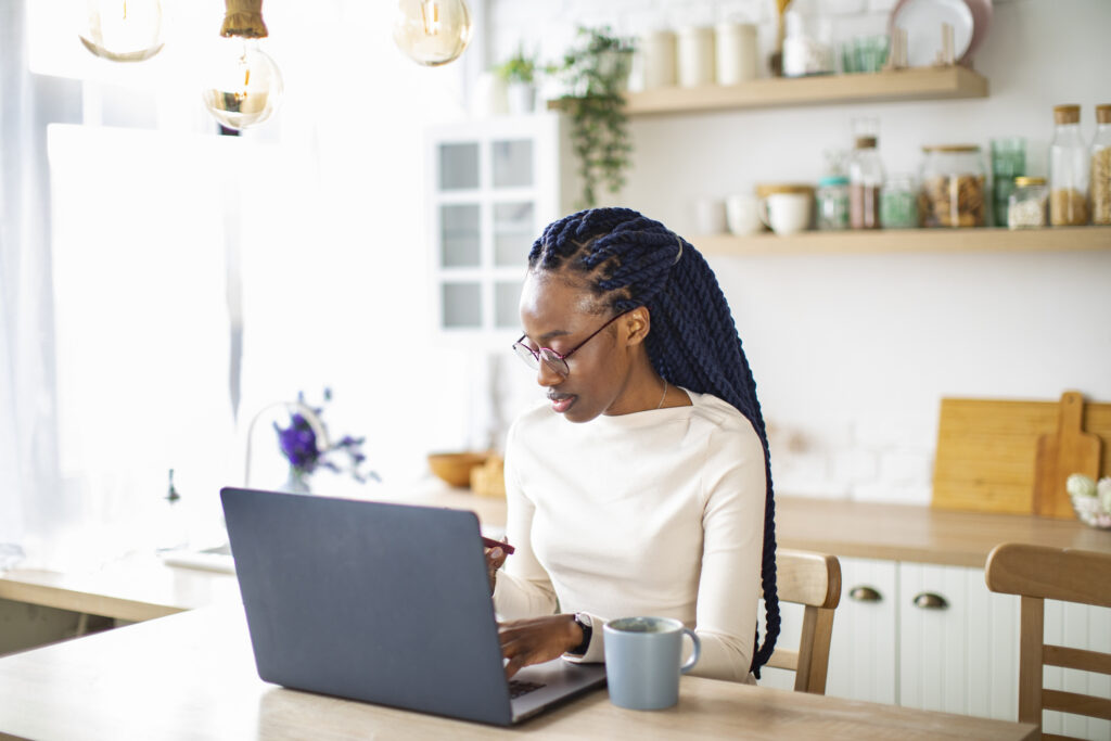 woman on her laptop in the kitchen