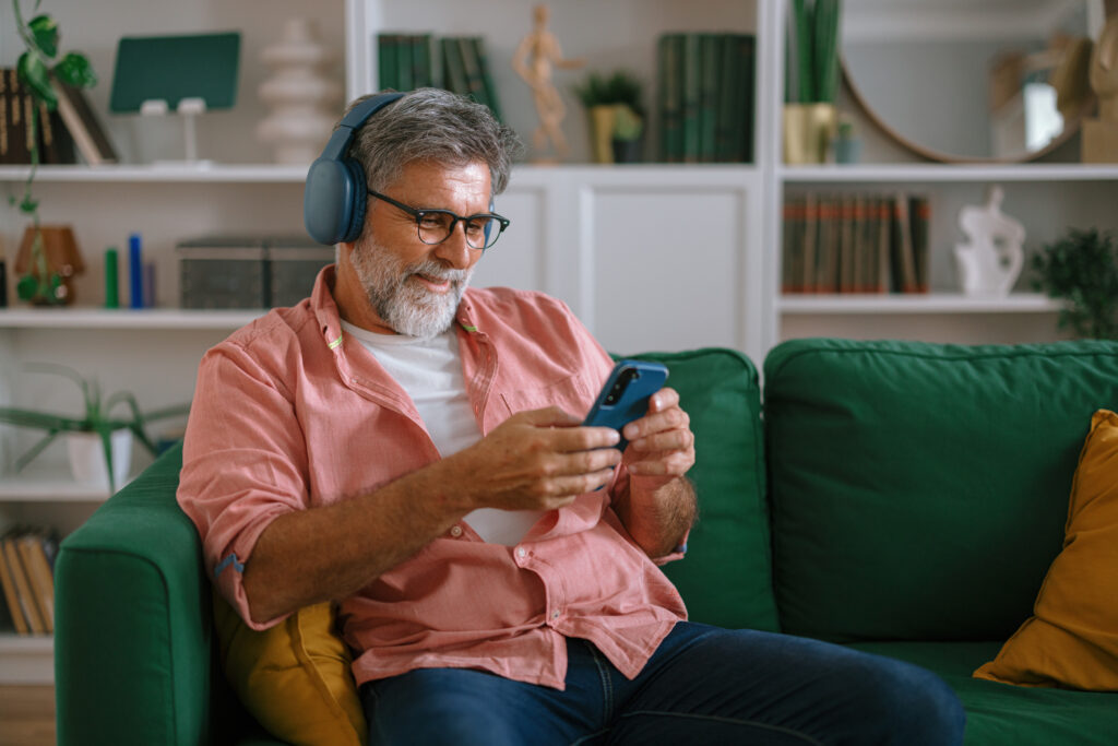 man listening to a podcast on headphones