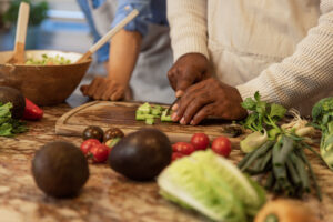 Close-Up of Hands Preparing Fresh Salad