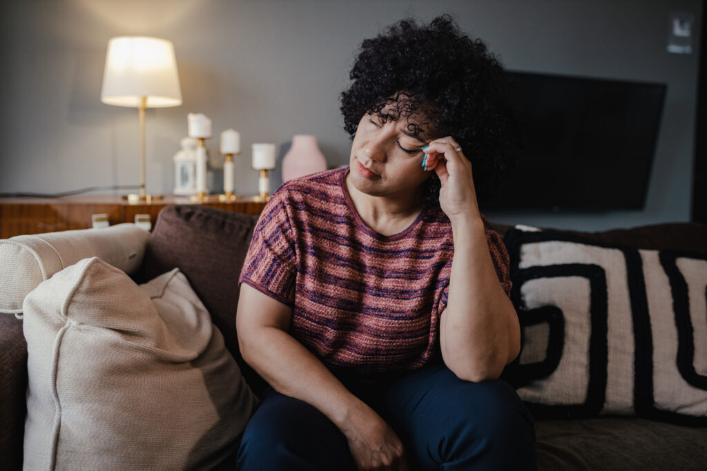 Portrait of mid adult woman feeling unwell