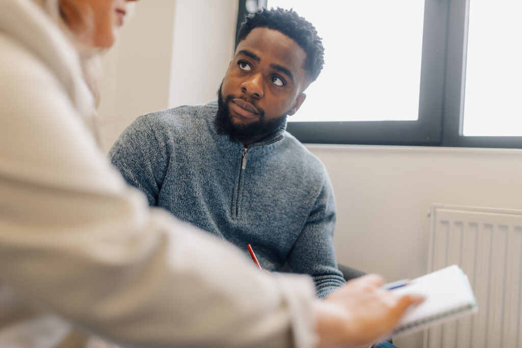 Patient explaining his problems to doctor