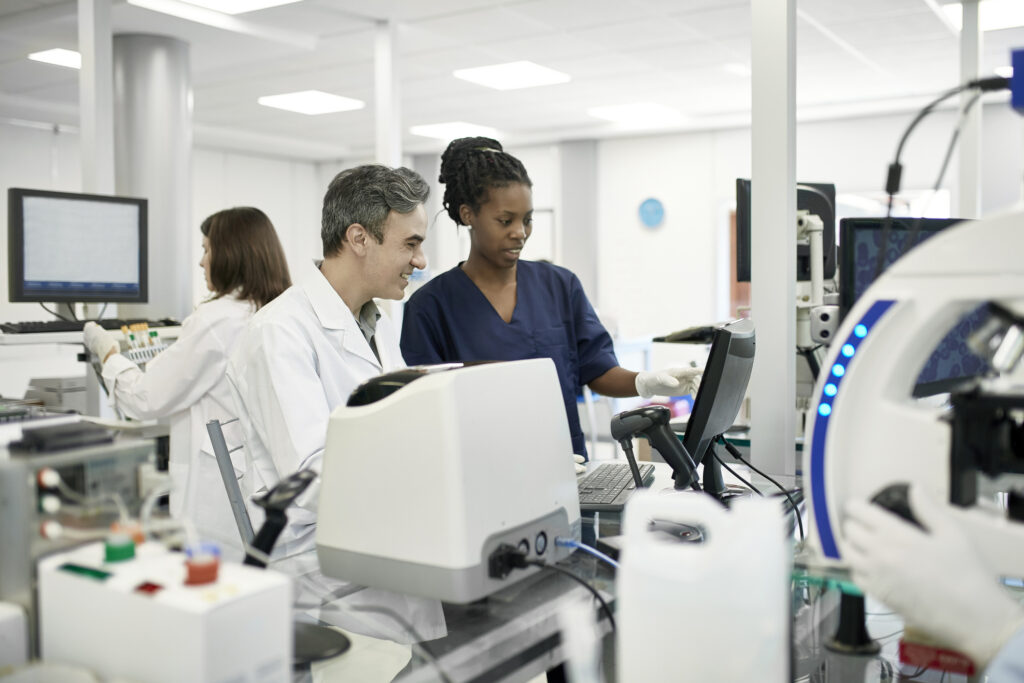 pathologists in white lab coats