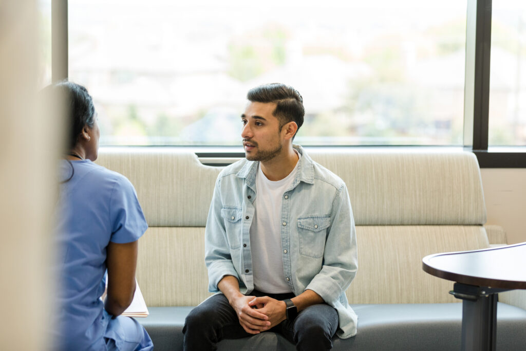 man talking to healthcare professional
