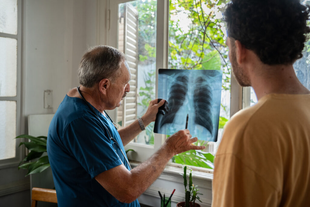 nurse explaining x-ray image to patient
